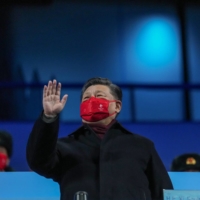 Chinese President Xi Jinping attends the closing ceremony of the 2022 Beijing Winter Olympics on Feb. 20. Despite spending much of the last decade focused on stability, Xi is facing more crises than ever before. | GABRIELA BHASKAR / THE NEW YORK TIMES