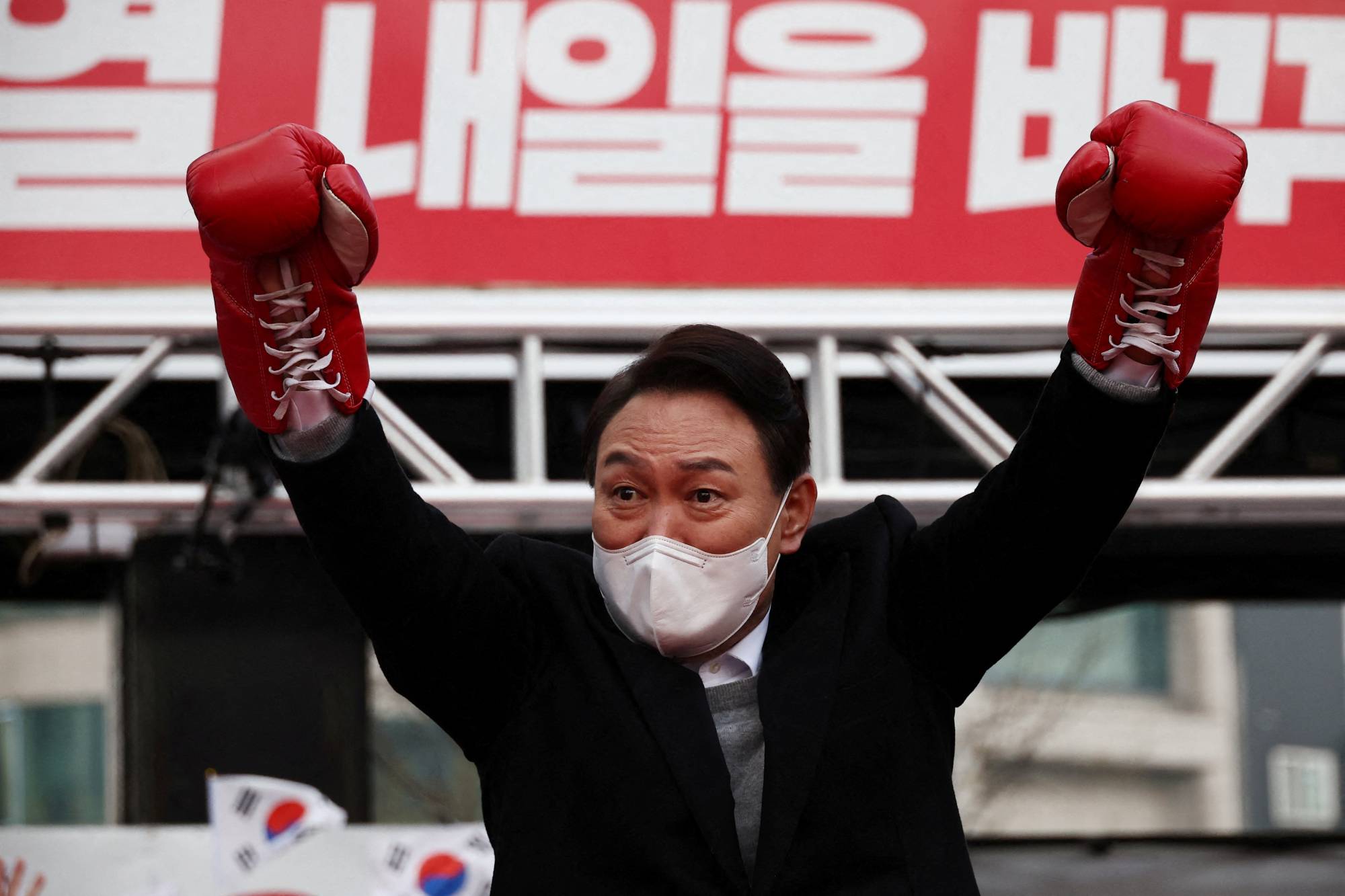 Yoon Seok-youl, presidential election candidate of South Korea's main opposition People Power Party, attends a campaign rally in Seoul on Tuesday. | REUTERS