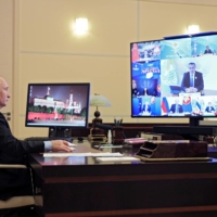 Russian President Vladimir Putin attends the virtual ASEAN East Asia Summit via video conference from his residence outside Moscow on Oct. 27.     | SPUTNIK / KREMLIN / VIA REUTERS