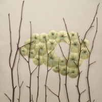 Artist Kazuhito Takadoi\'s \"Yuhi\" (\"Setting Sun\") is constructed from grass, hand-sewn over gold leaf, set behind hawthorn twigs, all harvested by the artist. | JAGGEDART