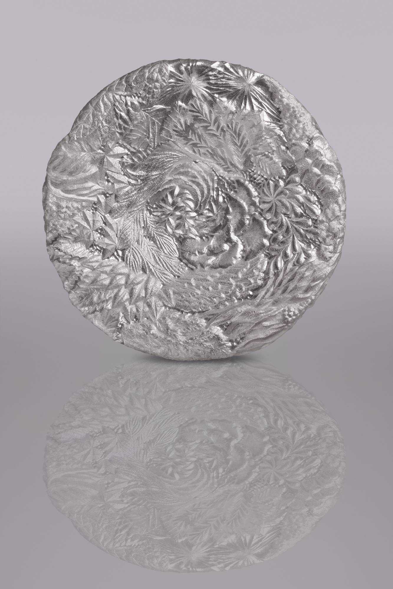 Silversmith Yusuke Yamada says his pieces feature Western influences such as stained glass and the works of William Morris, as well as Japanese elements from kimono textile motifs, traditional artists and hanging scroll paintings. | STEPHEN HEATON