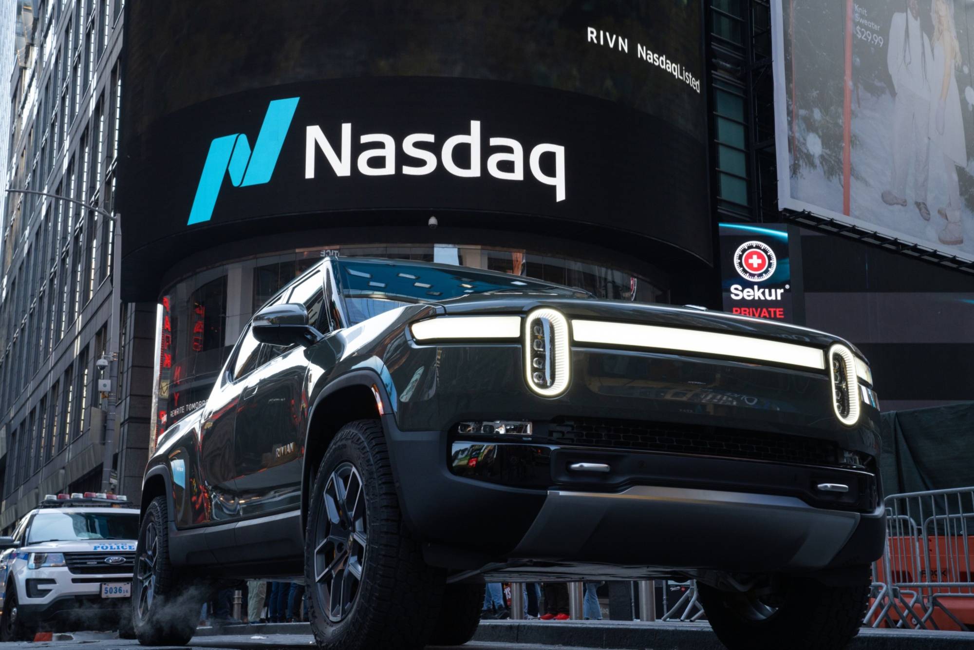 A Rivian R1T electric pickup truck displayed during the company's IPO outside the Nasdaq MarketSite in New York, on Nov. 10, 2021. | BLOOMBERG