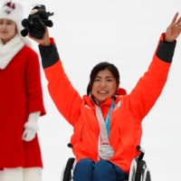 Momoka Muraoka celebrates with her silver medal after the women\'s slalom sitting event at the 2018 Winter Paralympics in Jeongseon, South Korea.  | REUTERS