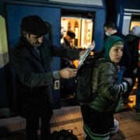Refugees coming from Ukraine arrive at the North Railway Station in Bucharest on Friday. | AFP-JIJI