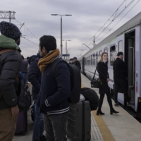 Refugees who left Ukraine at the train station in Radymno, Poland, on Thursday | MACIEK NABRDALIK / THE NEW YORK TIMES