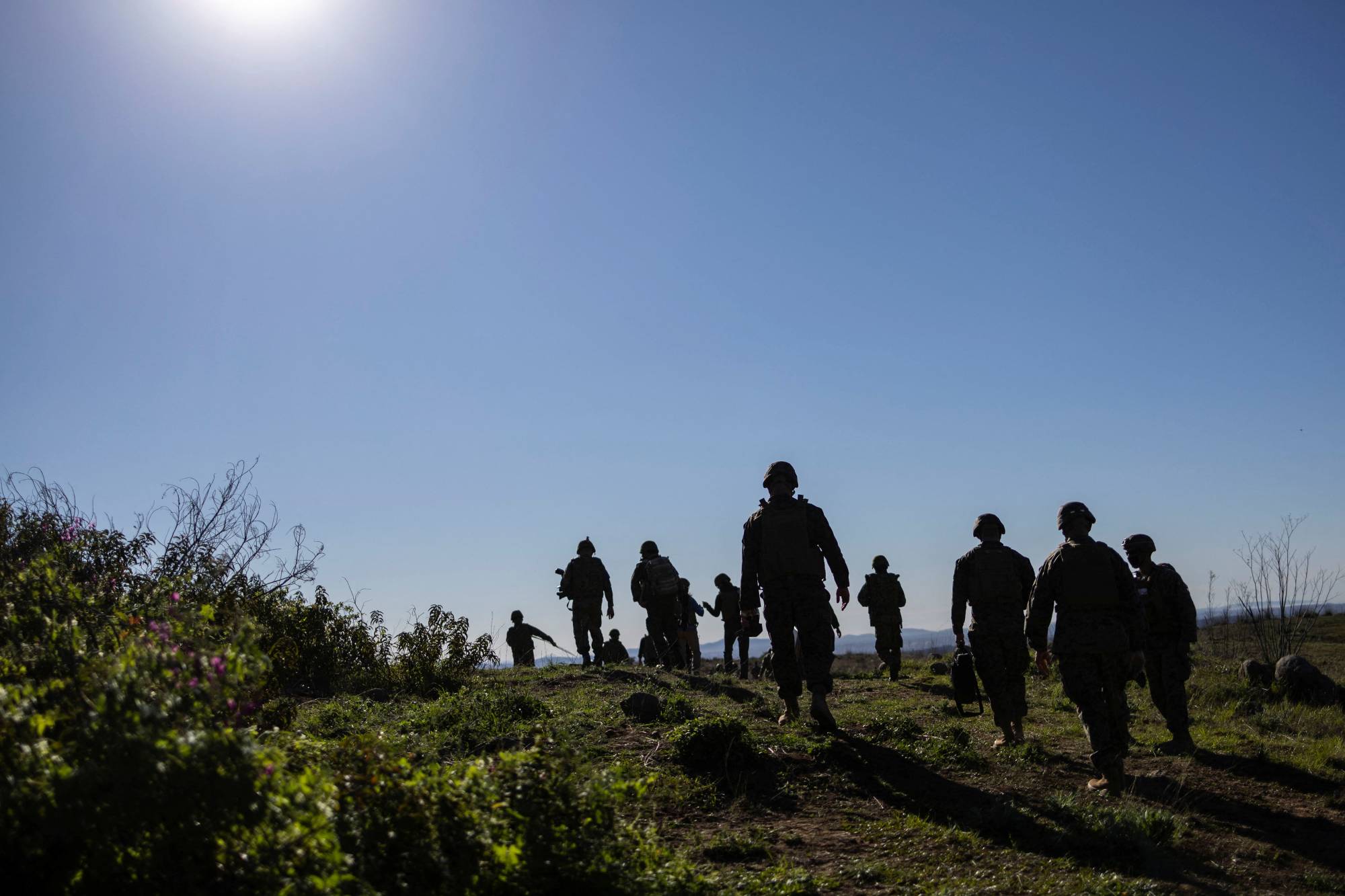 Ground Self-Defense Force members and U.S. Marines conduct a joint training exercise in Oceanside, California, on Feb. 9.  | REUTERS