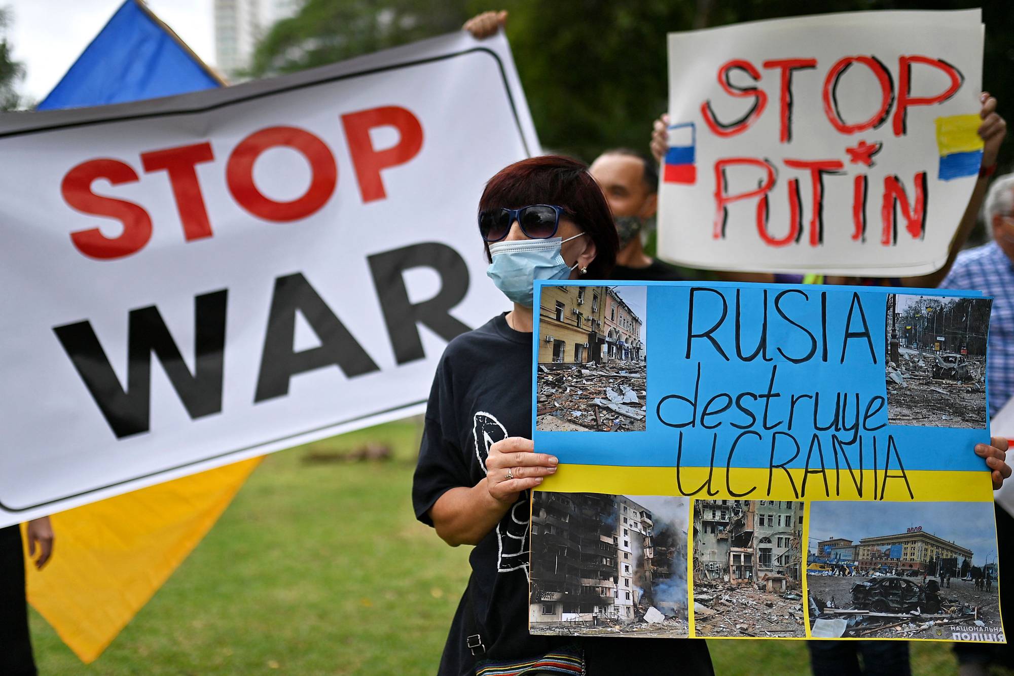 A Ukranian citizen takes part in a demonstration against the Russian invasion of Ukraine in Panama City on Wednesday. | AFP-JIJI