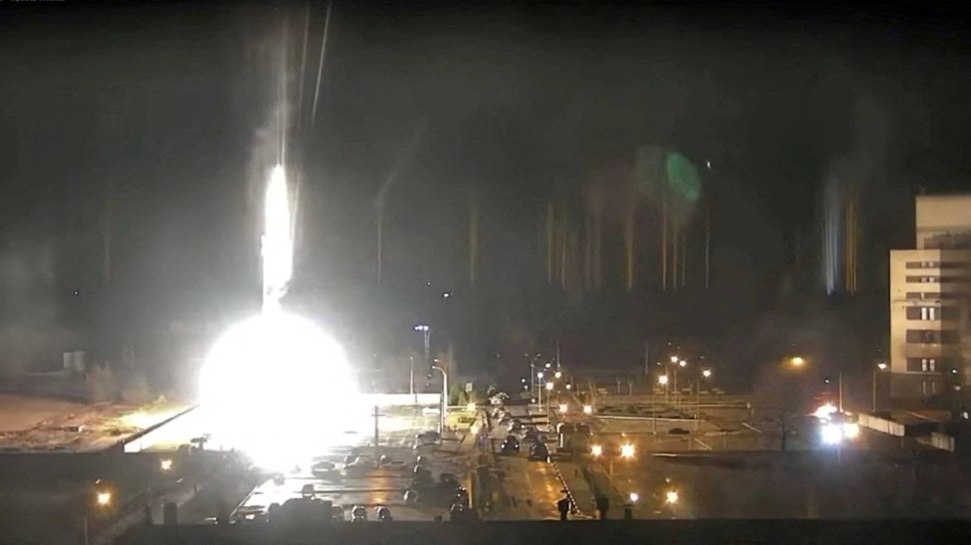 Surveillance camera footage shows a flare landing at the Zaporizhzhia nuclear power plant during shelling in Enerhodar, Ukraine, on Friday in this screen grab taken from YouTube. | REUTERS 