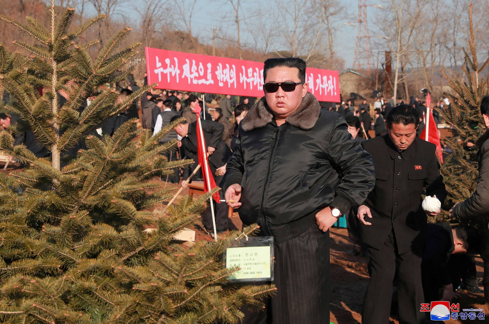 North Korean leader Kim Jong Un takes part in an event to plant trees with ruling party officials on Wednesday.  | KCNA / via REUTERS