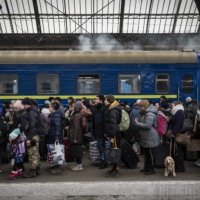 Ukrainians flee Lviv at a train station as Russians invade the country, on Wednesday. The multinational response to Russia\'s invasion of Ukraine has shown that the demise of the global postwar rules-based order may not be inevitable.  | IVOR PRICKETT/THE NEW YORK TIMES