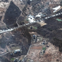 A Russian military convoy northwest of Kyiv in a satellite photo released Feb. 28.  | MAXAR TECHNOLOGIES / VIA THE NEW YORK TIMES