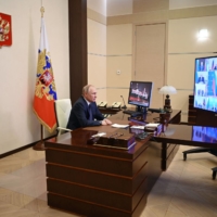 Russian President Vladimir Putin chairs a meeting on Thursday.  | SPUTNIK / VIA AFP-JIJI