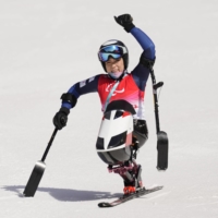 Sit skier Momoka Muraoka celebrates after winning the women\'s super-G race at the 2022 Winter Paralympics in Yanqing, China, on Sunday. | REUTERS