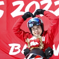 Sit skier Momoka Muraoka poses after the venue ceremony following her gold medal in the women\'s super-G race in Yanqing, China, on Sunday. | KYODO