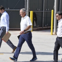 MLB Commissioner Rob Manfred (center) participated in negotiations with the players\' association in Florida on Feb. 28. | LYNSEY ADDARIO/THE NEW YORK TIMES