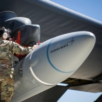 U.S. military personnel secure an Air-Launched Rapid Response Weapon as it is loaded under the wing of a B-52H Stratofortress at Edwards Air Force Base, California, in August 2020. | U.S. AIR FORCE / VIA REUTERS