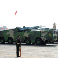 Military vehicles carrying hypersonic missiles DF-17 drive past Tiananmen Square during a military parade marking the 70th founding anniversary of People\'s Republic of China, in Beijing on Oct. 1, 2019. | REUTERS