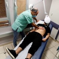 A patient suffering from long COVID is examined in the post-coronavirus disease clinic of Ichilov Hospital in Tel Aviv in Feb., 2022.  | REUTERS
