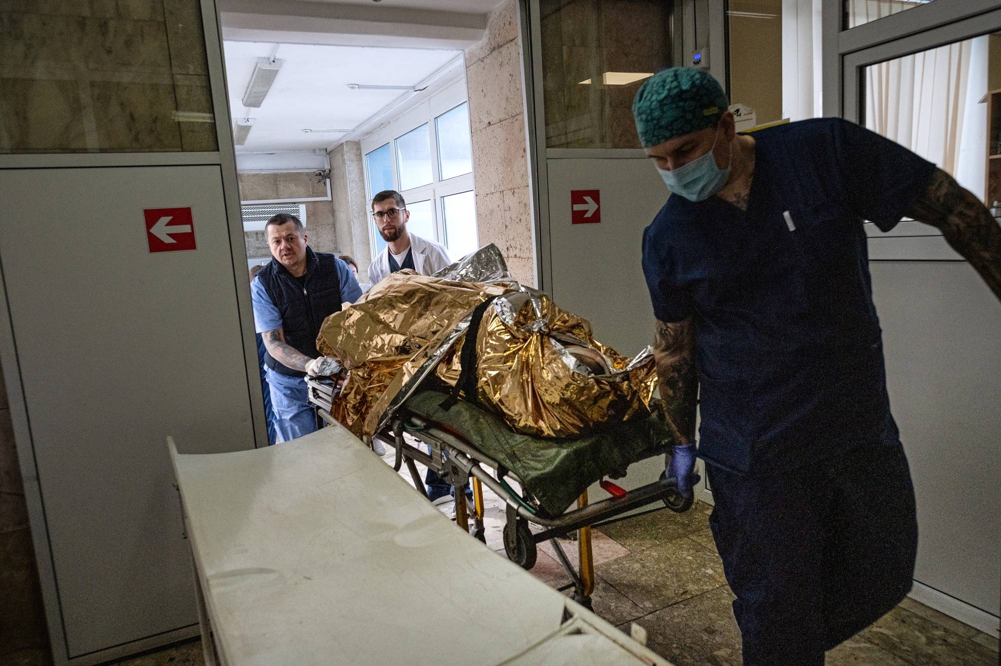 A wounded soldier is brought into Clinical Hospital No. 7 in Kyiv on Tuesday. | Lynsey Addario/The New York Times