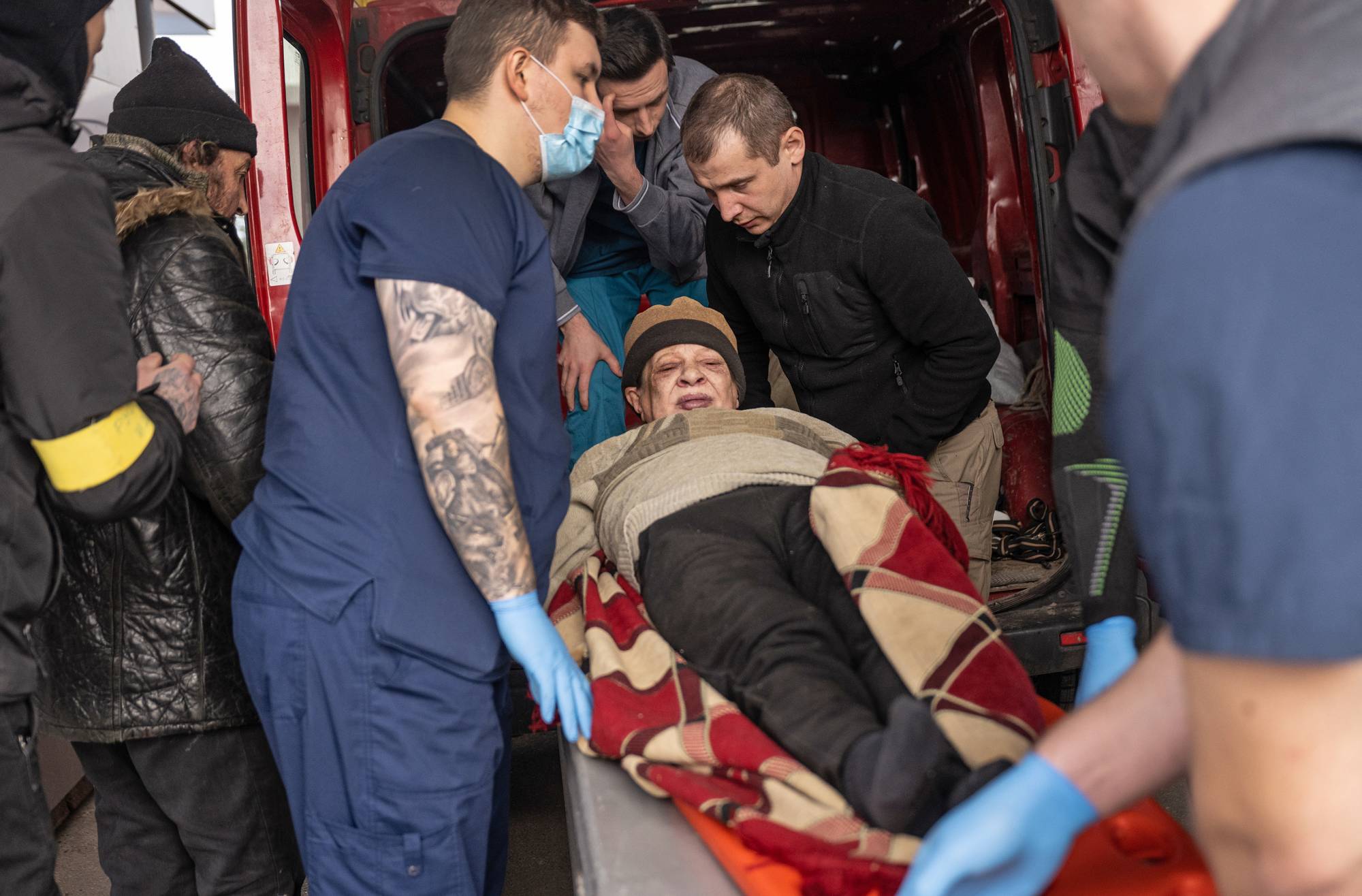 Iryna Vorobyova, 68, arrives at Clinical Hospital No. 7 in Kyiv after spending three days in a basement awaiting evacuation under heavy shelling in Irpin. | Lynsey Addario/The New York Times