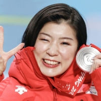 Momoka Muraoka poses with her silver medal from the women\'s super-G sit ski competition during the Beijing Paralympics in Yanqing, China, on Tuesday. | KYODO