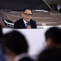 Akio Toyoda, president of Toyota Motor Corp., speaks during a news conference at the company\'s showroom in Tokyo in December. | BLOOMBERG