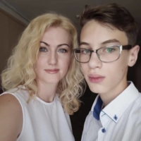 In an image provided her husband, Tetiana Perebyinis and her son Mykyta, 18 who were killed by Russian mortar fire on Sunday alongside Alisa, 9, and a volunteer trying to help the family evacuate Irpin, Ukraine. | SERHIY PEREBYINIS / VIA THE NEW YORK TIMES