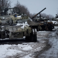 Destroyed Russian tanks in the Sumy region of Ukraine on Monday. Realists like John Mearsheimer predicted some kind of conflict over Ukraine, but their predictions still did not describe the current reality of the conflict. | UKRAINIAN GROUND FORCES PRESS SERVICE / VIA REUTERS