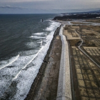 Part of a roughly 245-mile (394 kilometer) sea wall near the Fukushima Daiichi nuclear power plant in Fukushima Prefecture, Japan, on March 4, 2021. The structure is designed to protect against future tsunamis. | JAMES WHITLOW DELANO / THE NEW YORK TIMES
