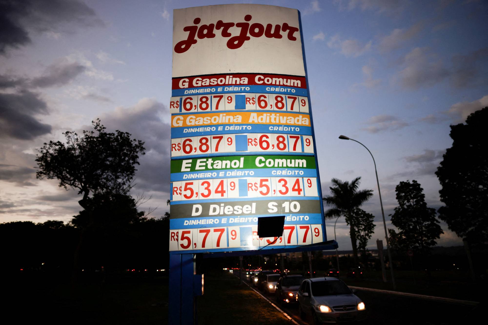 Research on past oil shocks offers a sense of what to expect. Even as gas prices rise, fuel consumption and driving tend to remain steady, partly out of necessity, as well as choice. | Reuters