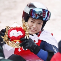 Momoka Muraoka took gold in the women\'s Sitting Giant Slalom event at the Beijing 2022 Winter Paralympic Games on Thursday. | KYODO