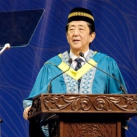 Former Prime Minister Shinzo Abe delivers a speech in Malaysia\'s Selangor state on Saturday. | KYODO