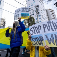 Demonstrators march in Tokyo on March 5 during a protest against Russia\'s actions in Ukraine. | AFP-JIJI