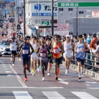Runners compete in the 75th and final edition of the Fukuoka International Marathon in Fukuoka on Dec. 5. | KYODO
