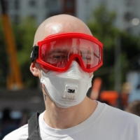 Russian rapper Oxxxymiron wears protective gear to prevent COVID-19 infection in Moscow in June 2020. The 37-year-old, whose real name is Miron Fyodorov, postponed concerts in Moscow and St. Petersburg because of the Russian invasion, which he has called a \"catastrophe and a crime.\" | REUTERS