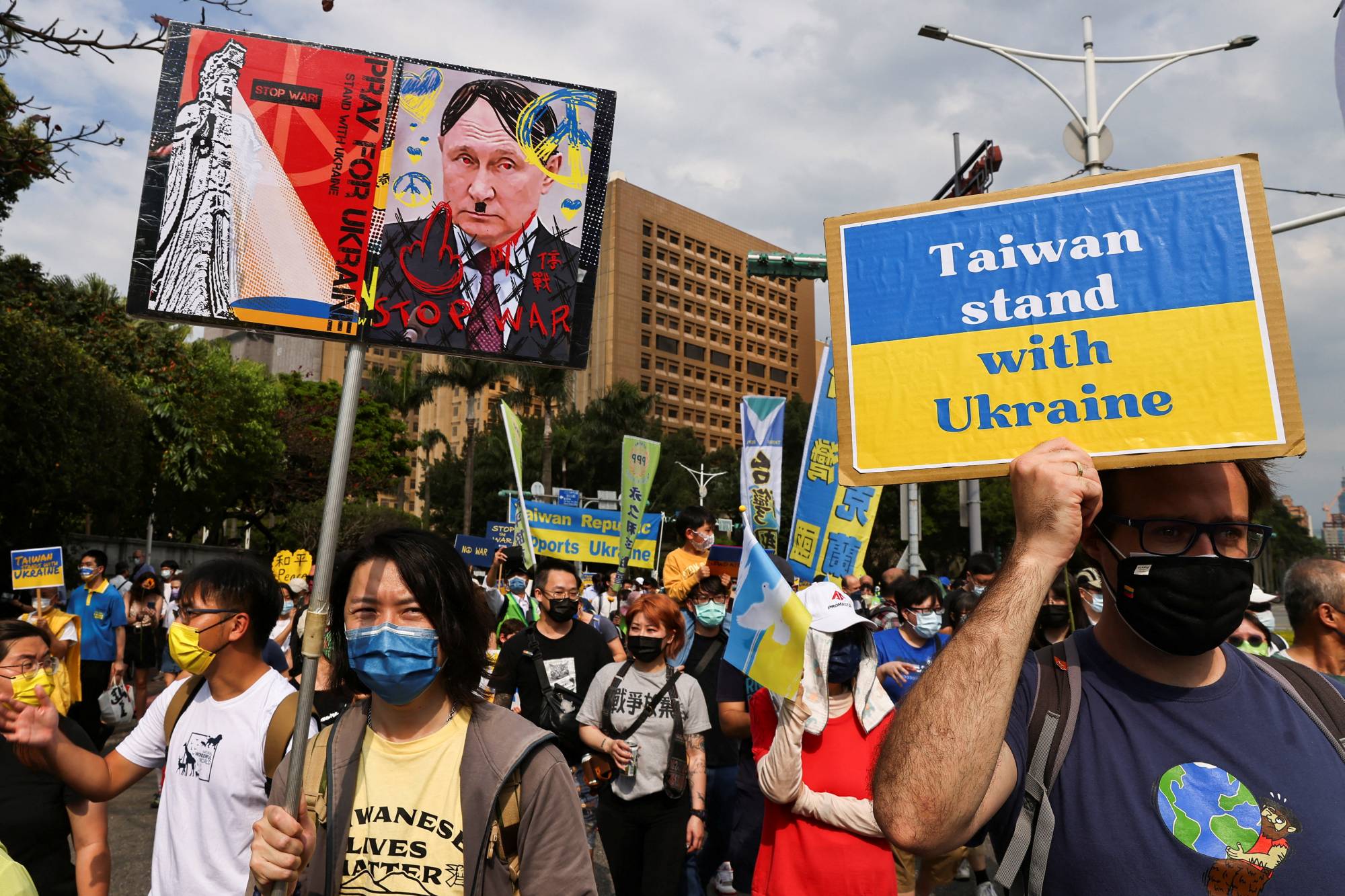 People across Taiwan have held near-daily solidarity rallies, such as this one here in Taipei on Sunday, to show support for Ukraine in its battle for survival with Russia. | REUTERS