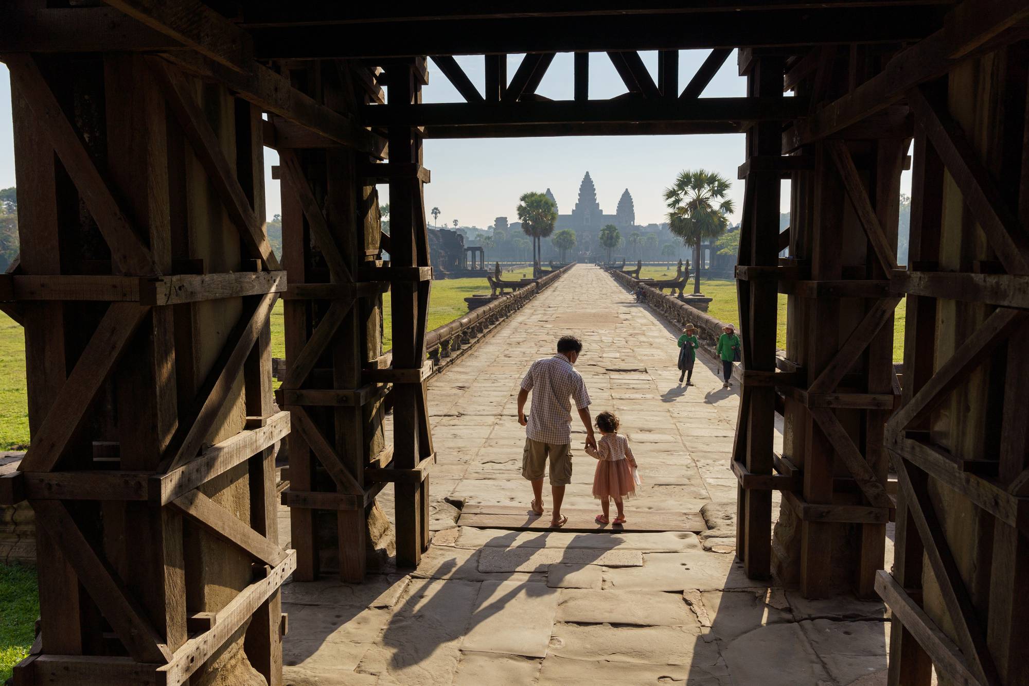 Visitors at Angkor Wat in Siem Reap, Cambodia, on Feb. 26. As Asia reopens its borders, travelers should expect more paperwork, higher airfares and cheaper hotels — at least for the short-term. | Thomas Cristofoletti / The New York Times