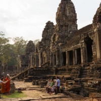 Visitors at the Bayon temple in Siem Reap, Cambodia, on Feb. 26. Countries like Cambodia were among favorite destinations of Chinese tourists but China has no plans to reopen its borders anytime soon. | THOMAS CRISTOFOLETTI / THE NEW YORK TIMES