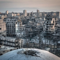 Destruction is seen in the Syrian city of Homs on June 15, 2014. As the world takes in the grim realities of Russia’s invasion of Ukraine, many Syrians have watched with a horrifying sense of deja vu and a deep foreboding about what lies ahead.   | SERGEY PONOMAREV / THE NEW YORK TIMES