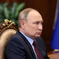 Russian President Vladimir Putin attends a meeting in Moscow on March 2. | KREMLIN / VIA REUTERS