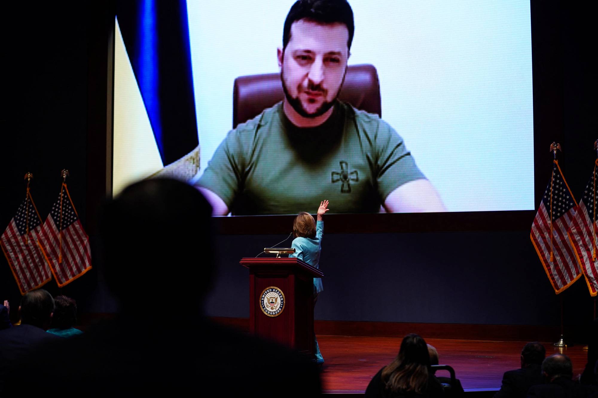 Ukrainian President Volodymyr Zelenskyy delivers a video address to senators and members of the U.S. House of Representatives gathered in the Capitol Visitor Center Congressional Auditorium in Washington on Tuesday. | REUTERS