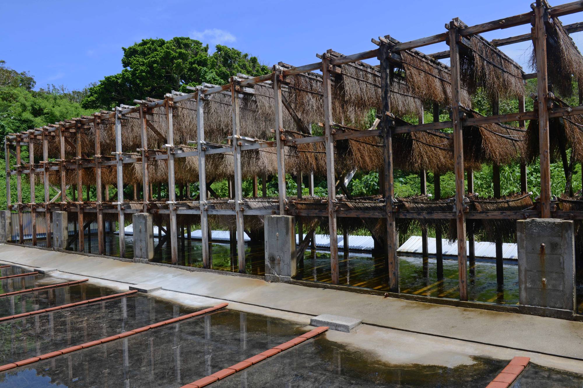 A large wooden frame is used for the circulating and drying salt particles at Takaesu Seienjo. | STEPHEN MANSFIELD 