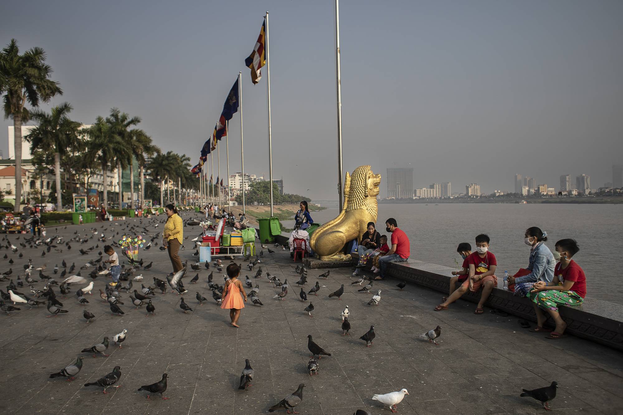 The waterfront along the Mekong River in Phnom Penh, on Jan. 29. Much of the population has no personal memory of the country’s deadliest years. | Nadia Shira Cohen / The New York Times
