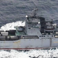 A photo taken by the Defense Ministry on Wednesday shows a Russian tank landing ship with vehicles on its deck. | JAPAN JOINT STAFF / VIA KYODO
