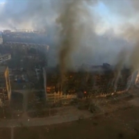 Smoke rising from damaged residential buildings following an explosion in Mariupol, Ukraine on Monday. | REUTERS  