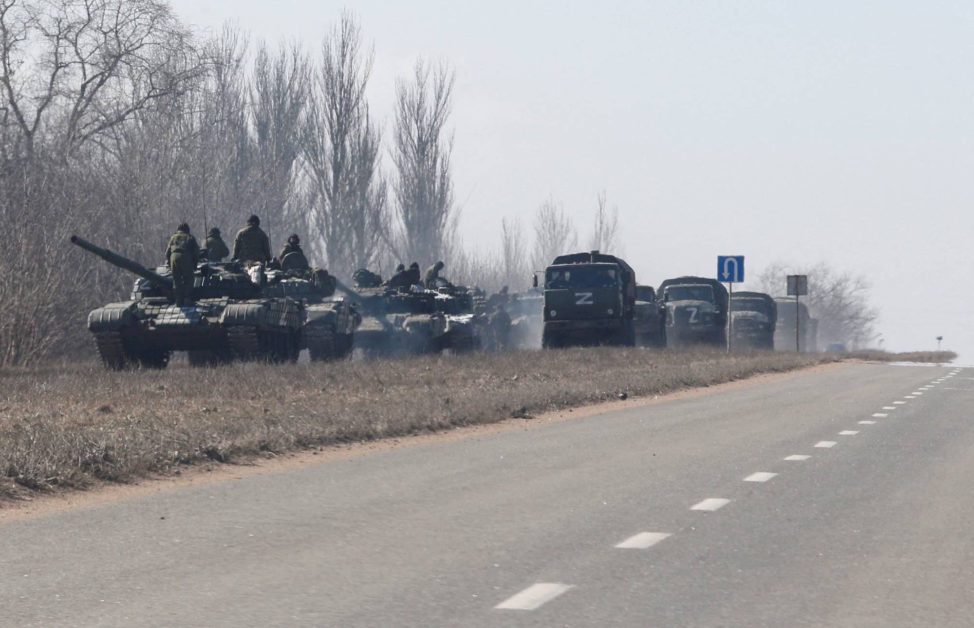 A view shows a convoy of pro-Russian troops during the Ukraine-Russia conflict outside the separatist-controlled town of Volnovakha in the Donetsk region of Ukraine on March 12. | Reuters