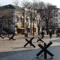 Anti-tank obstacles line a deserted street in the center of Odessa, Ukraine, on Wednesday. After initial gains, the Russian military’s southern advance has met strong resistance. | BLOOMBERG