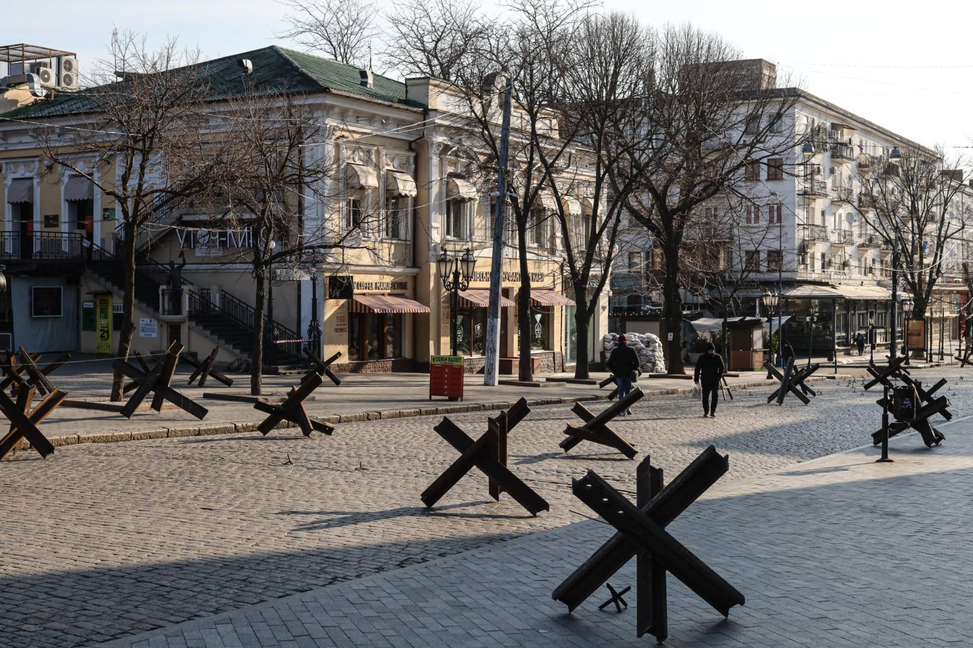 Anti-tank obstacles line a deserted street in the center of Odessa, Ukraine, on Wednesday. After initial gains, the Russian military’s southern advance has met strong resistance. | Bloomberg