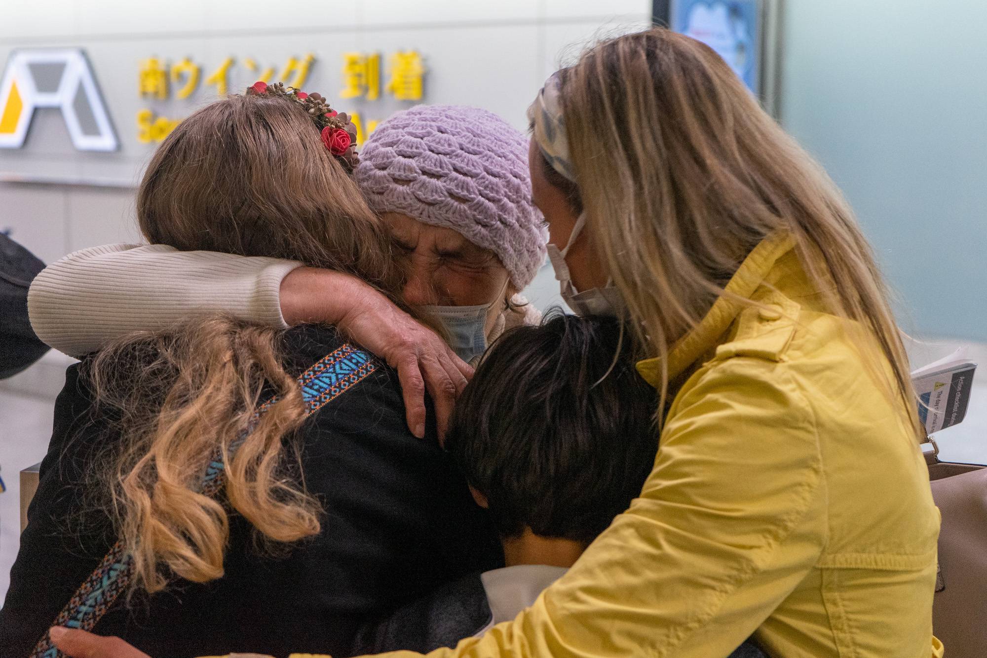 Ukrainian Maria Dovbash hugs her family in an emotional reunion Friday at Narita Airport after she traveled over seven days from her home in Zaporizhzhia in southern Ukraine to Japan. | OSCAR BOYD