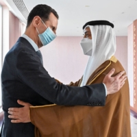 Syrian President Bashar Assad (left) is greeted by Sheikh Mansour bin Zayed Al Nahyan, UAE deputy prime minister and minister of presidential affairs, in the capital, Abu Dhabi, on Friday. | UAE\'S MINISTRY OF PRESIDENTIAL AFFAIRS / VIA AFP-JIJI